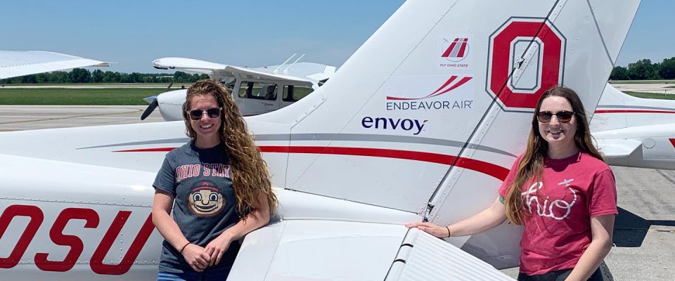 OSU Flight Team posing with OSU and Envoy branded Cessna