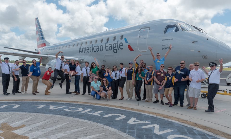 Team Envoy poses in front of an E175 at ERAU Daytona